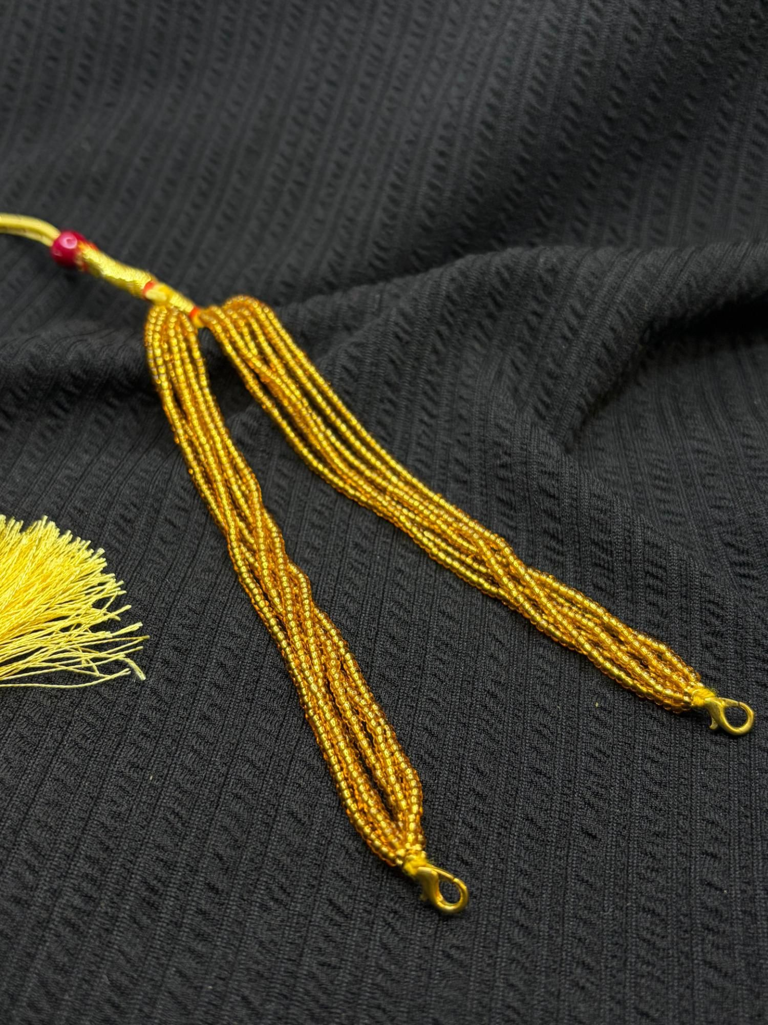Golden chini beads tassel