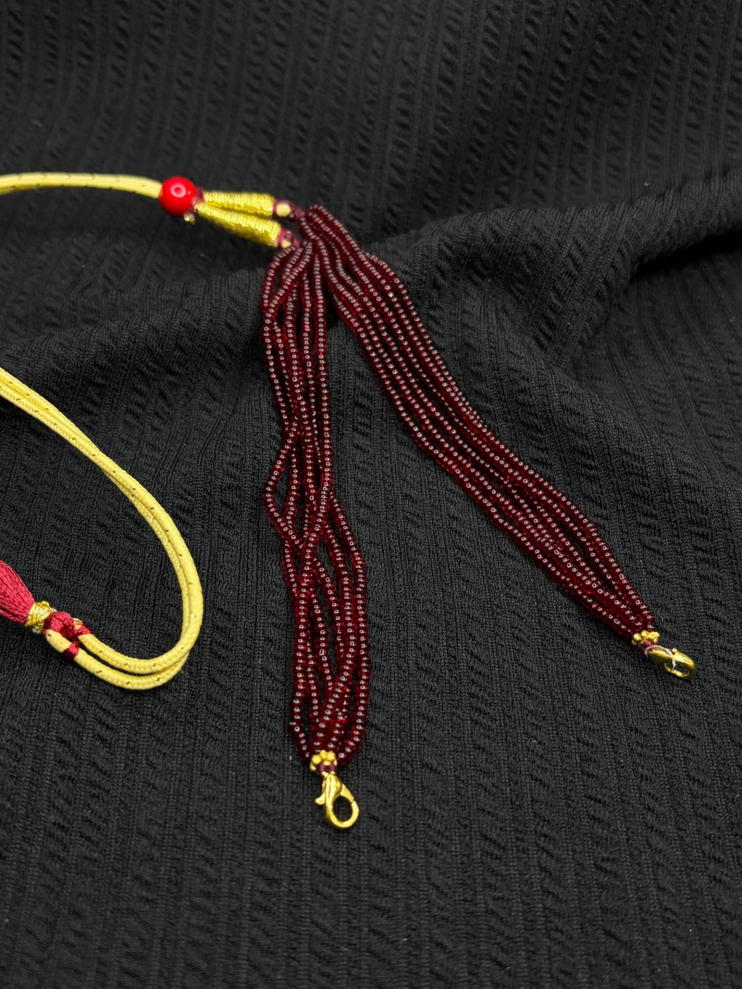 Maroon chini beads tassel