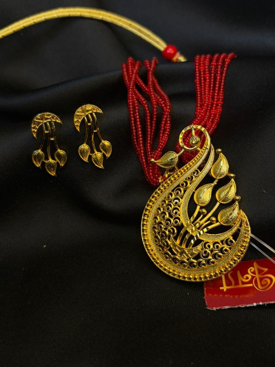 Peacock leaf pendant