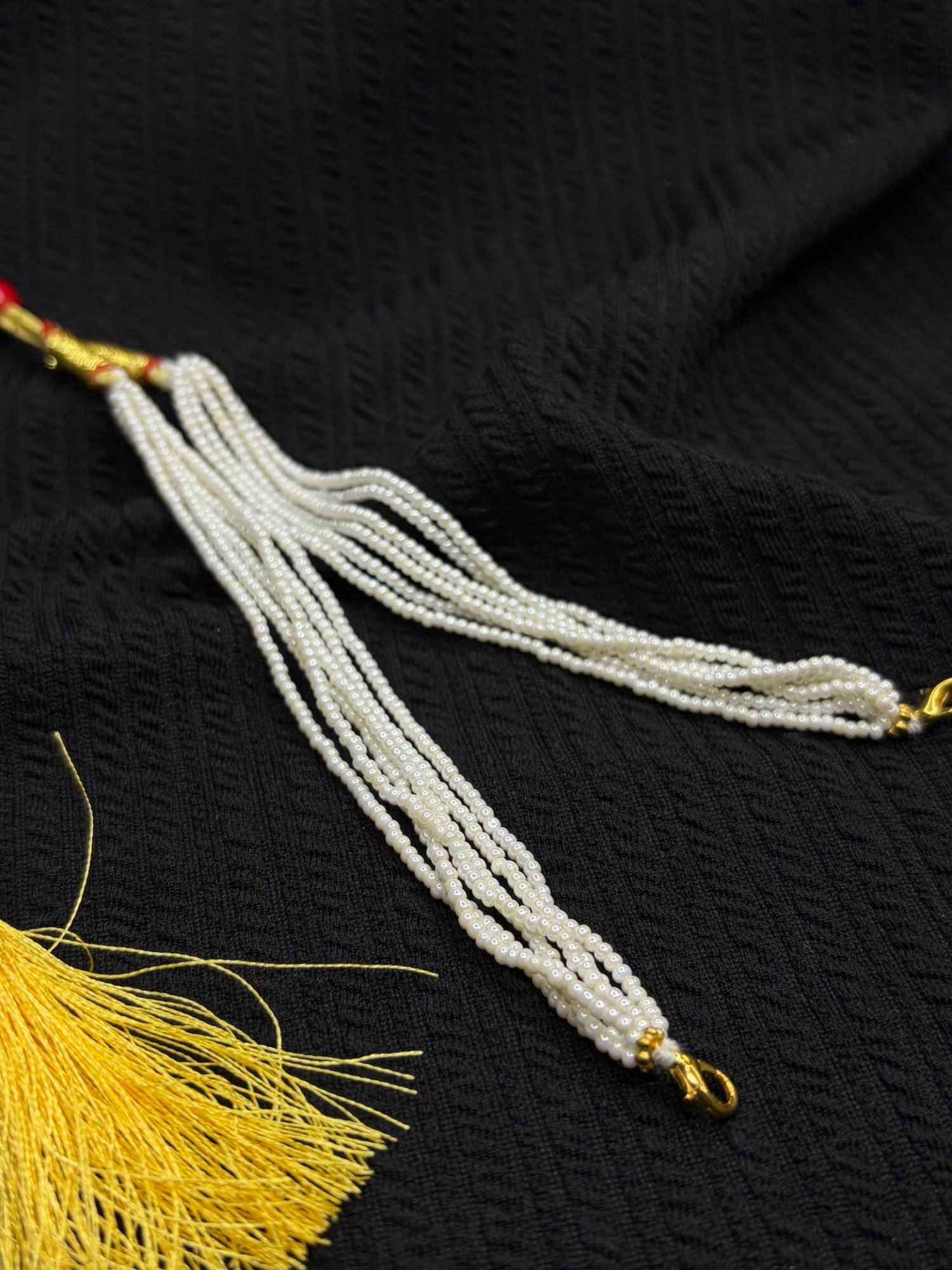White chini beads tassel